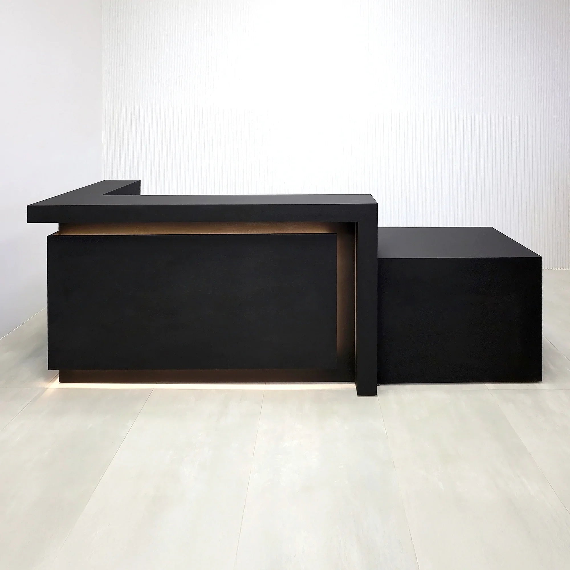 108-inch New York L ADA Reception Desk with Black Cinder Matte laminate desk, Black Cinder matte laminate workspace, Black Cinder matte laminate front panel, and Warm White LED with remote control.
