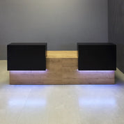 120-inch Los Angeles Double Counter Custom Reception Desk in black matte laminate counters, planked urban oak matte laminate desks, and color changing LED.
