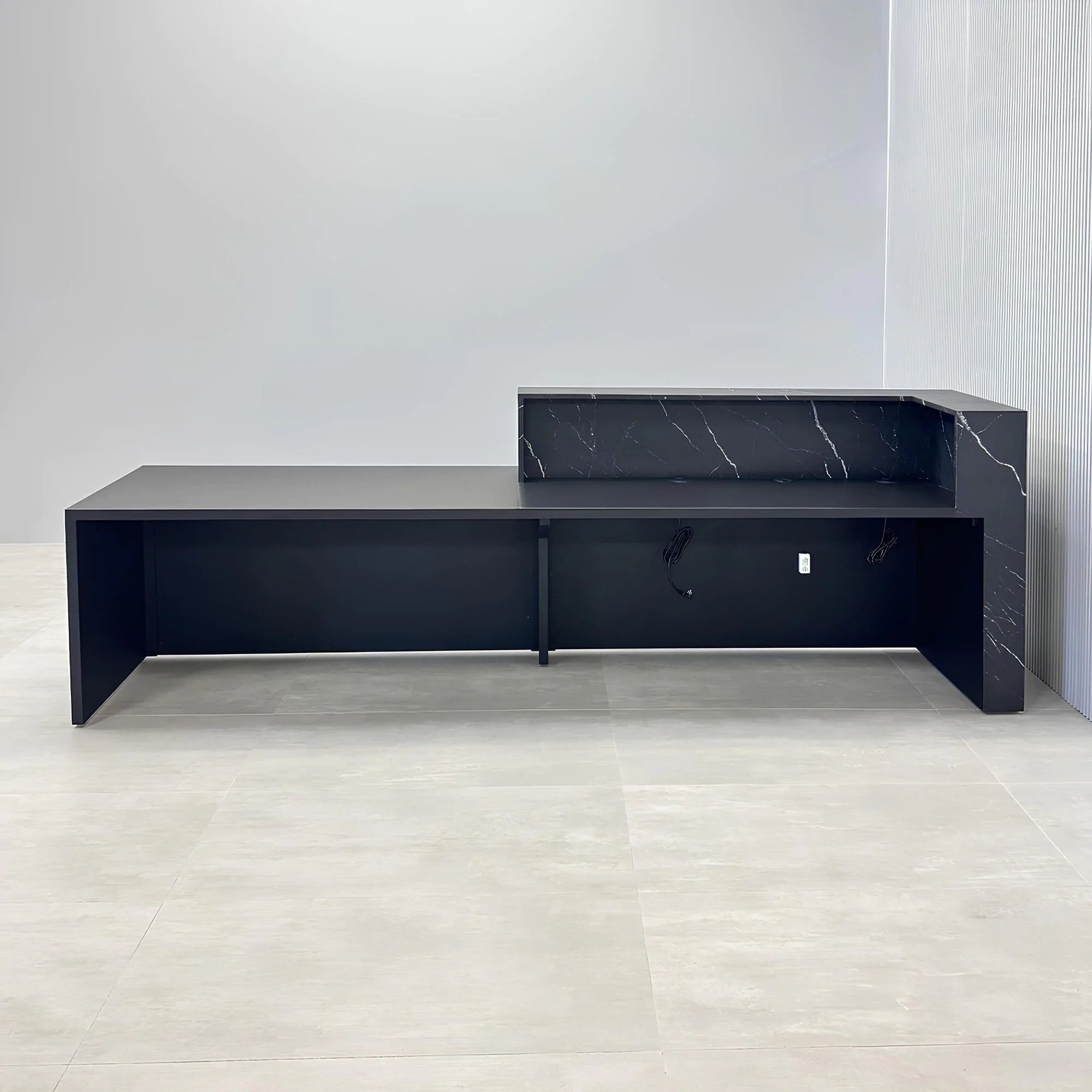 132-inch Atlanta Custom ADA Reception Desk with black stone palazzo desk, black traceless laminate workspace & accent panel, and colored LED.