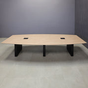 144-inch Aurora Boat Conference Table in 1/2-inch countryside oak engineered surface top, black matte laminate base, and two black MX3 power boxes.