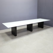 144-inch Omaha Rectangular Conference Table with white glass top, black matte laminate base, and 2 MX2 power boxes in white.