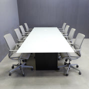 144-inch Omaha Rectangular Conference Table with white glass top, black matte laminate base, and 2 MX2 power boxes in white.
