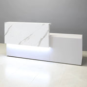 96-inch Los Angeles Long and ADA Compliant Custom Reception Desk with the counter on the left side when facing front in calcutta stone PVC, white gloss laminate desk, and warm white LED.