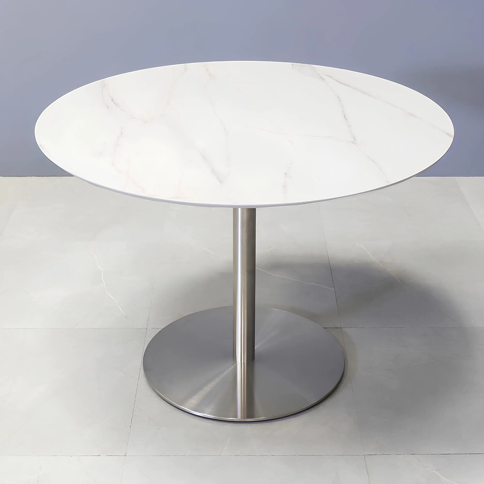 42-inch California Round Conference Table with 1/2-inch calcutta blanc engineered surface top and silver metal powder-coated base.