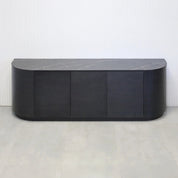 84-inch Milano Curved Storage Credenza with Pietra Noir Engineered Surface Top, Ebony wood veneer credenza & doors, and Ebony wood veener toe-kick.