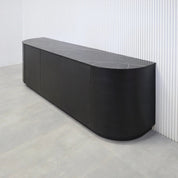 84-inch Milano Curved Storage Credenza with Pietra Noir Engineered Surface Top, Ebony wood veneer credenza & doors, and Ebony wood veener toe-kick.