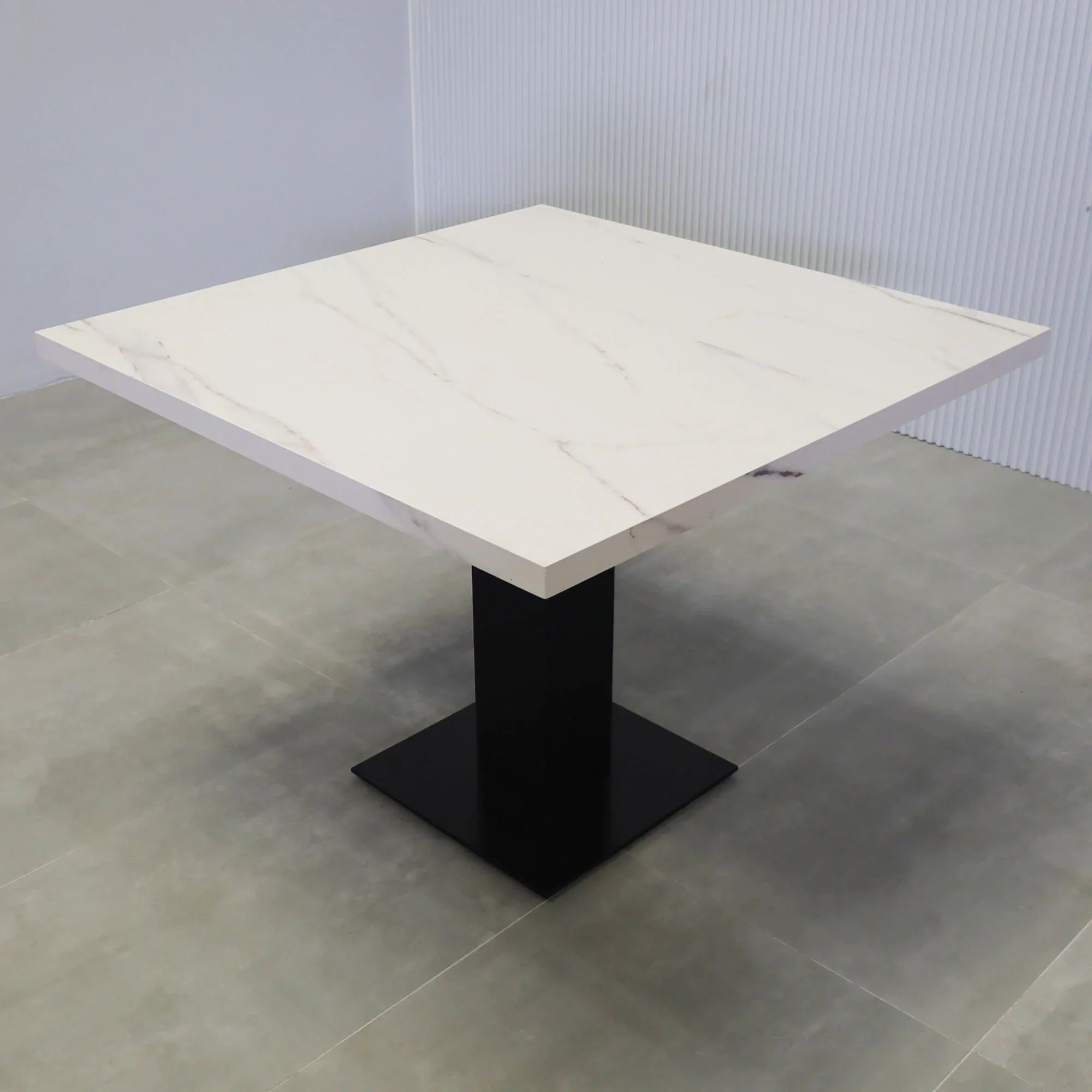 40-inch California X2 Round Conference Table in 1 1/2-inch solenne marble engineered surface top, black traceless laminate pedestal, metal powder coated base in black.
