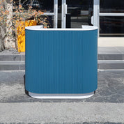 48-inch The Pill Podium Desk with Dover Off-White matte laminate workspace, hand-painted Sapphire CSP-690 Benjamin Moore solid wood tambour accent, and Dover Off-White matte laminate toe-kick.