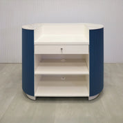 48-inch The Pill Podium Desk with Dover Off-White matte laminate workspace, hand-painted Sapphire CSP-690 Benjamin Moore solid wood tambour accent, and Dover Off-White matte laminate toe-kick.
