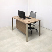 48-inch Dallas Straight Executive Desk with Hazel Walnut matte laminate, Hazel Walnut matte laminate privacy panel, and Brushed Aluminum legs.
