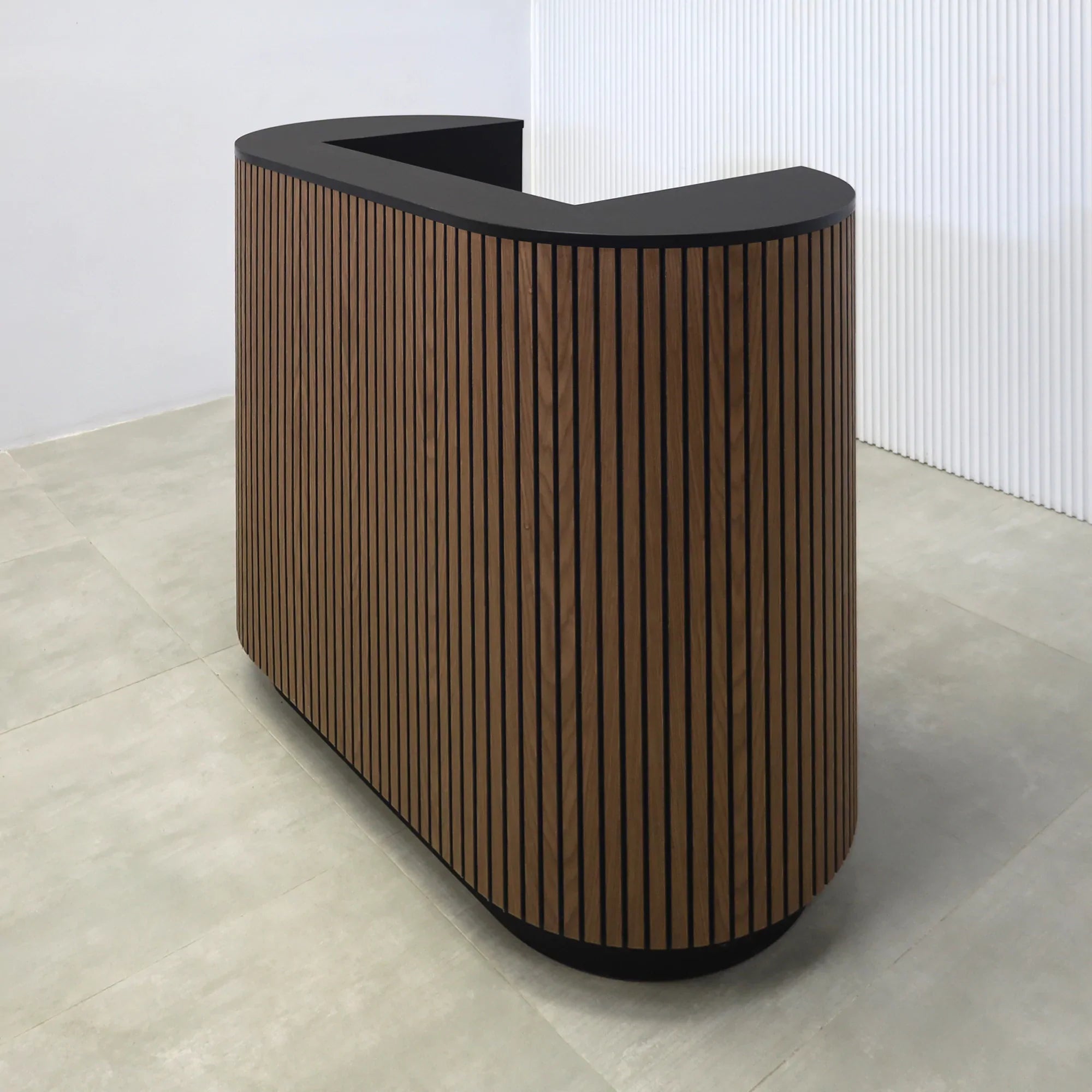 48-inch The Pill X2 Podium & Host Custom Desk with Walnut Tambour and Black background main body. Black Traceless laminate workspace and Top. Black Traceless laminate toe-kick.