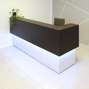 90-inch San Francisco L-Shape Reception Desk, right l-panel side when facing front in ebony recon matte laminate counter and white matte laminate desk, with color LED, shown here.