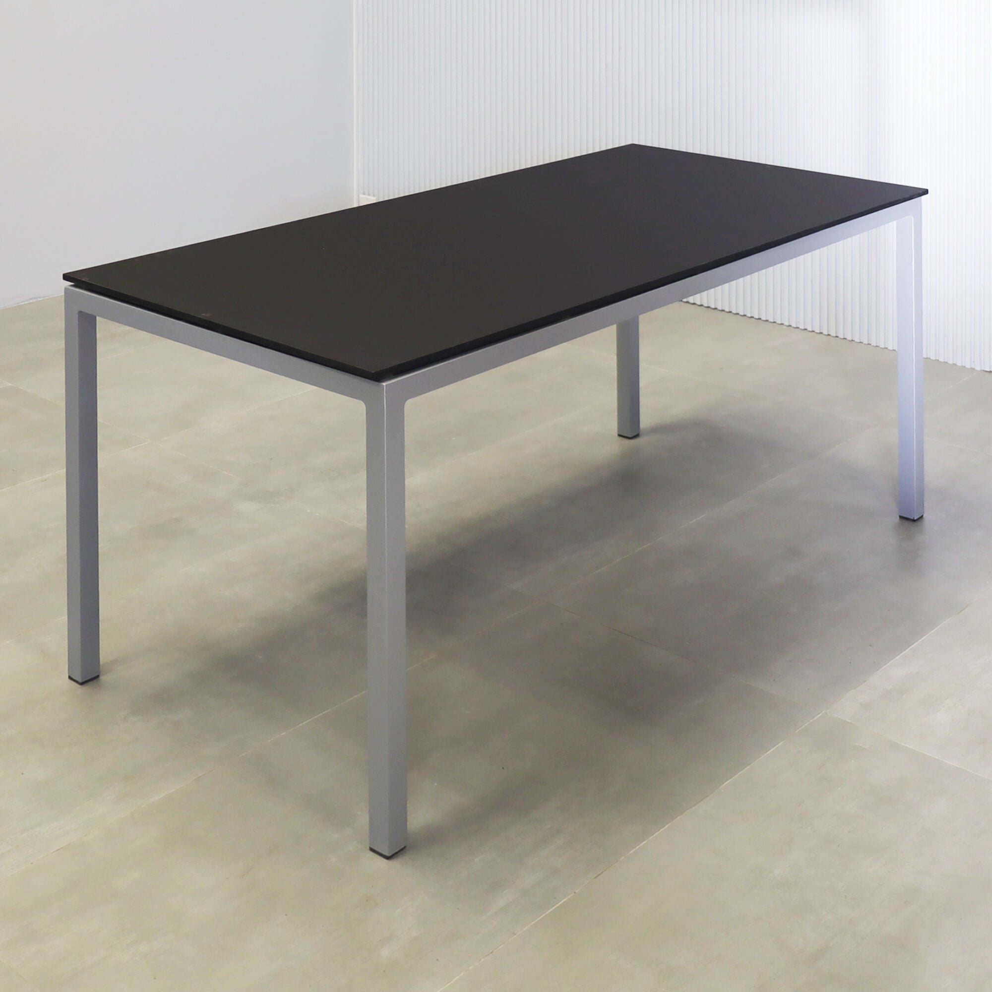 60-inch Aspen Rectangular Conference Table in 1/2" black traceless engineered surface top, and metal powder coated silver base.
