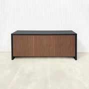 60-inch Boston Storage Credenza with black traceless laminate main body and walnut tambour with black background doors and push-to-open mechanism.