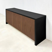 60-inch Boston Storage Credenza with black traceless laminate main body and walnut tambour with black background doors and push-to-open mechanism.