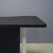 60-inch aXis Sit-stand Executive Desk with black traceless laminate top & privacy panel, and white metal legs, shown here.