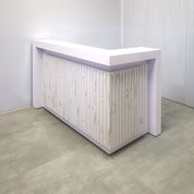 60-inch New York L-Shape Reception Desk with White Matte laminate counter, White Matte laminate workspace, White Matte laminate accent panel, Solenne Marble slats, and Color LED.