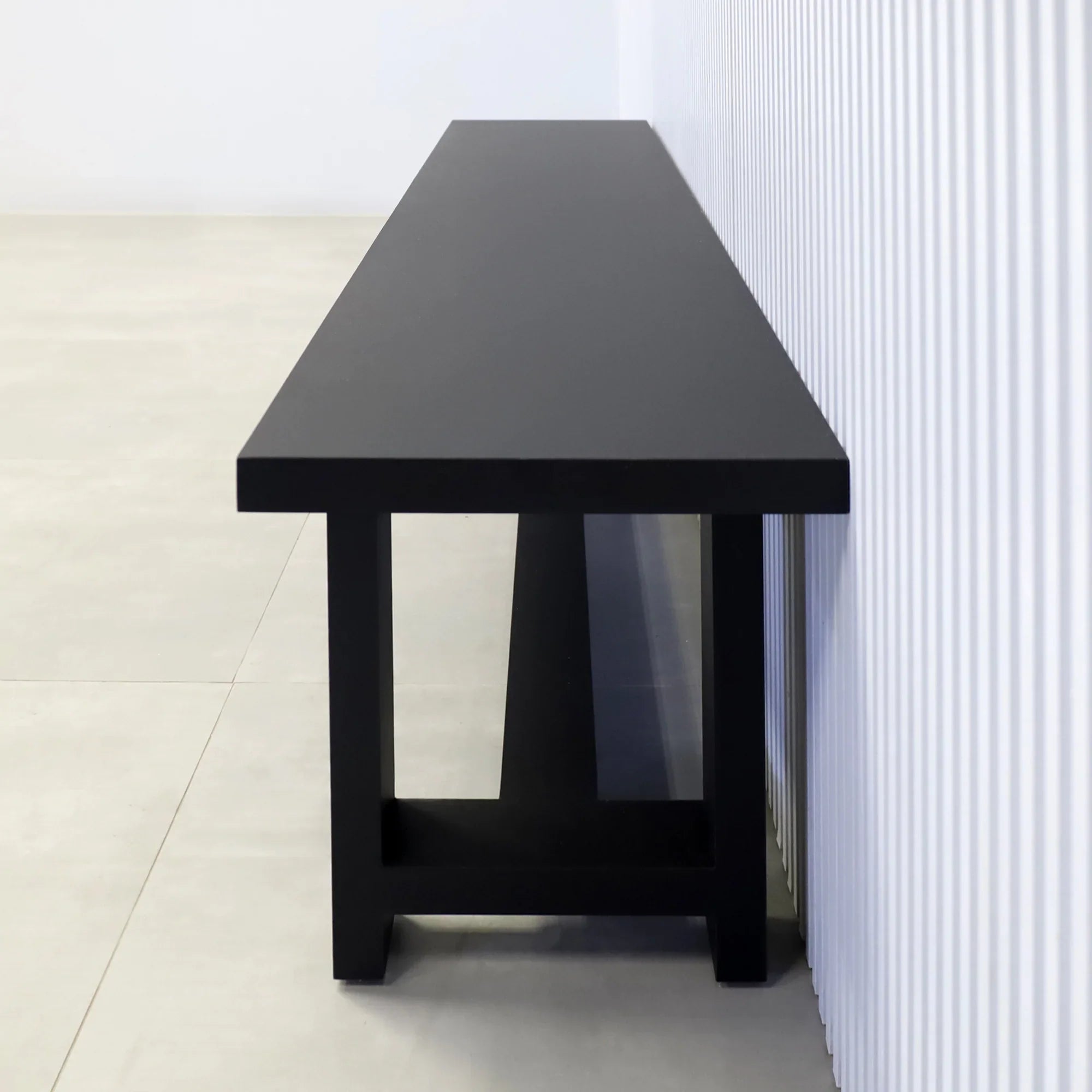 68-inch Charlotte Custom Bench in black traceless laminate seat and black traceless laminate base.