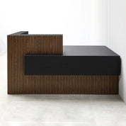72-Inch Atlanta Custom Reception Desk with American Walnut tambour counter & base. Black Traceless laminate workspace & Accent Panel.