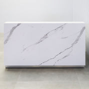 72-inch Dallas Straight Custom Reception Desk with calcutta stone PVC laminate and brushed aluminum toe-kick. 