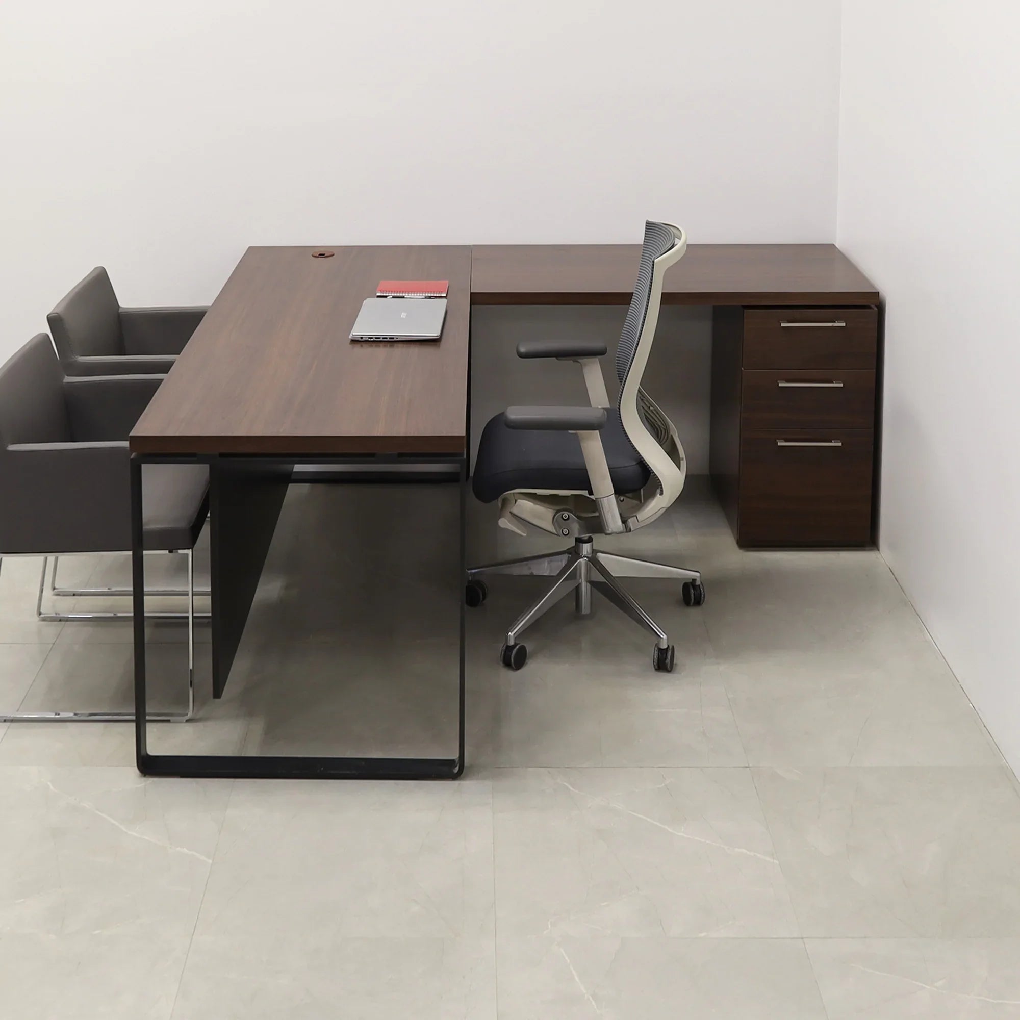 72 inches Aspen L-Shape W/ Cabinet Executive Desk In Colombian Walnut Laminate Top and storage with two pencil drawers and one file cabinet. Black matte laminate privacy panel and black stainless metal legs shown here.