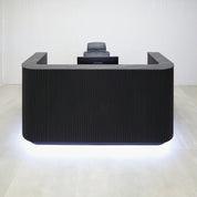 72-inch Nola Reception Desk with Pietra Noir engineered surface countertop, Black Traceless tambour main, Black Stone Palazzo laminate workspace, and Warm White LED.