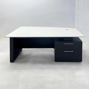 Avenue Straight Executive Desk with light gray traceless engineered surface top, black traceless laminate base & cabinet, and black traceless laminate privacy panel.