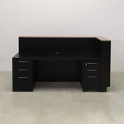 84-inch Manhattan L-Shape Custom Reception Desk in walnut heights matte laminate accent panel and top counter, and BLACK TRACELESS laminate main desk. Gold aluminum toe-kick, with multi-colored LED, shown here.