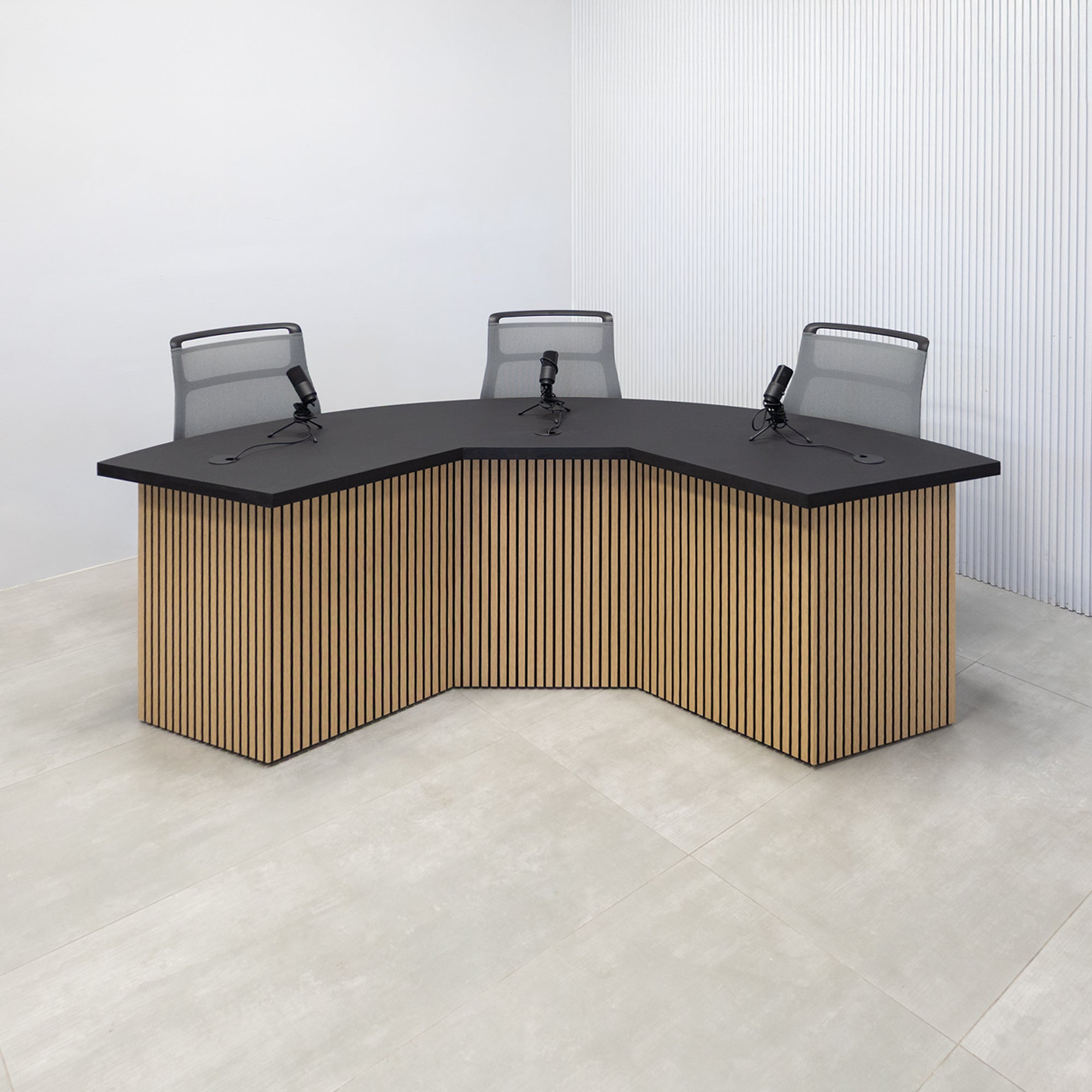 90-inch Tampa Bay Podcast Table with Black Cider matte laminate top, White Oak tambour & Black background front base, Black matte laminate back base. 