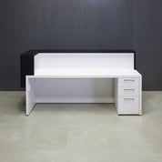 90-inch San Francisco L-Shape Reception Desk, right l-panel side when facing front in black matte laminate counter and white matte laminate desk, with white LED, and built-in storage on right side when sitting, shown here.