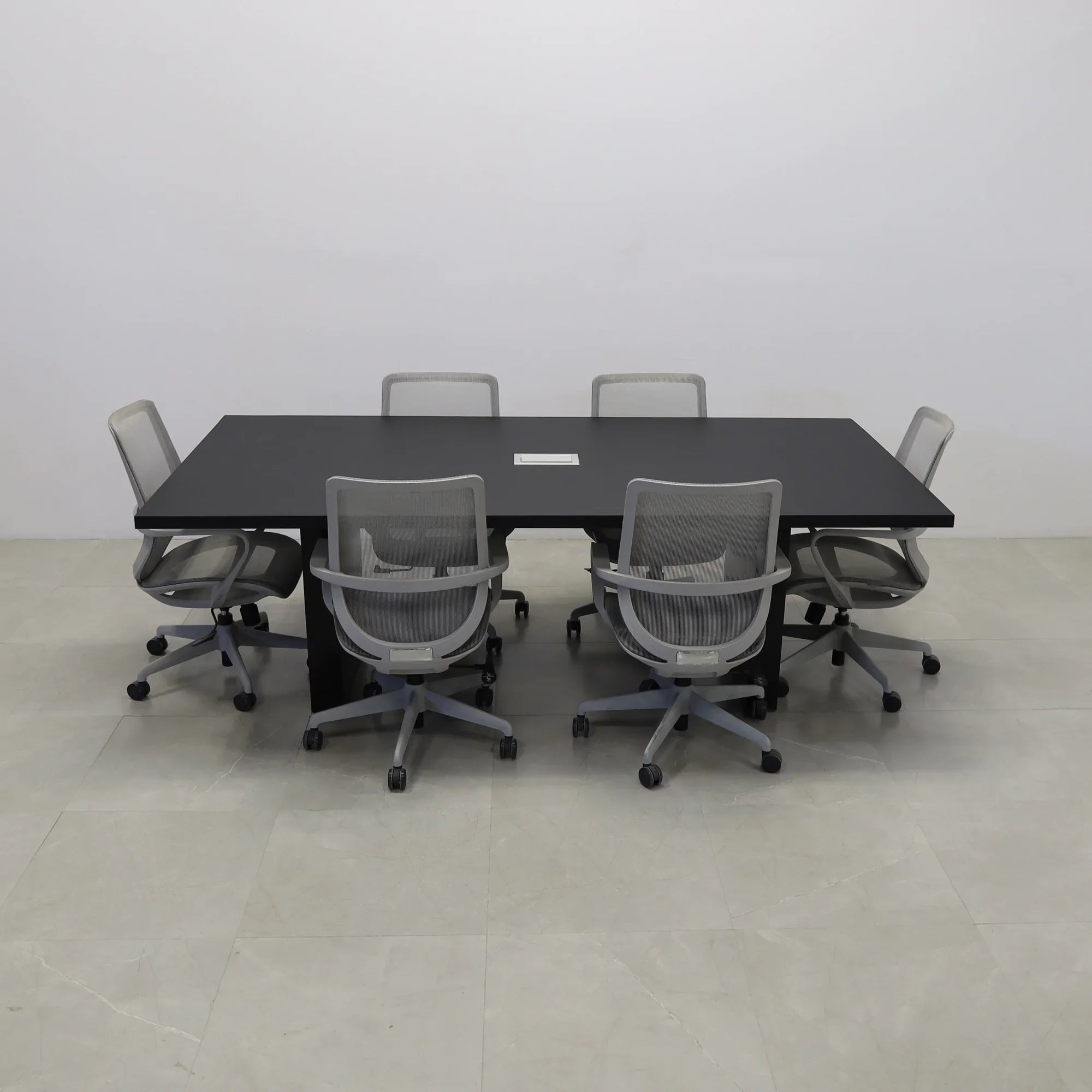 92 inches Newton Rectangular Conference Table in Black Traceless Laminate top and Black Matte Laminate base finish. Ellora power box, and six gray chairs shown here.