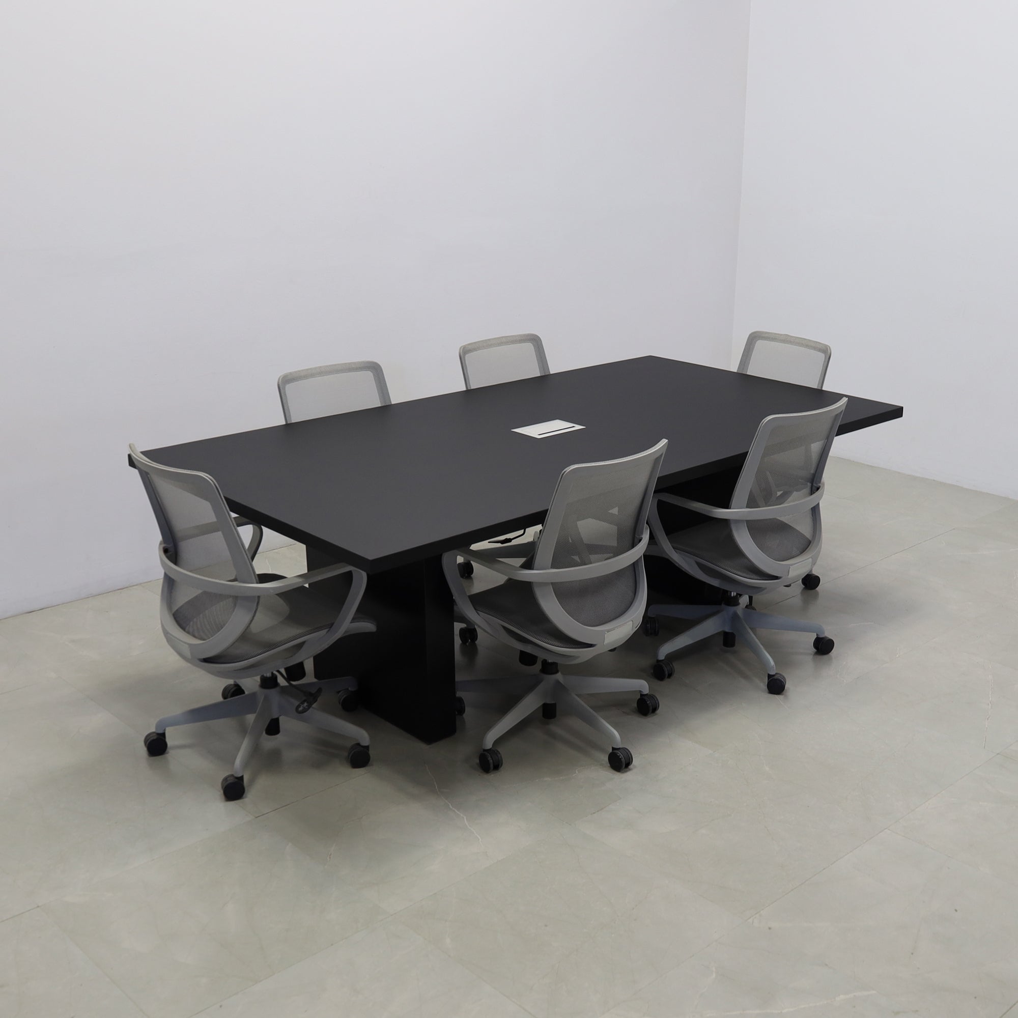 92 inches Newton Rectangular Conference Table in Black Traceless Laminate top and Black Matte Laminate base finish. Ellora power box, and six gray chairs shown here.