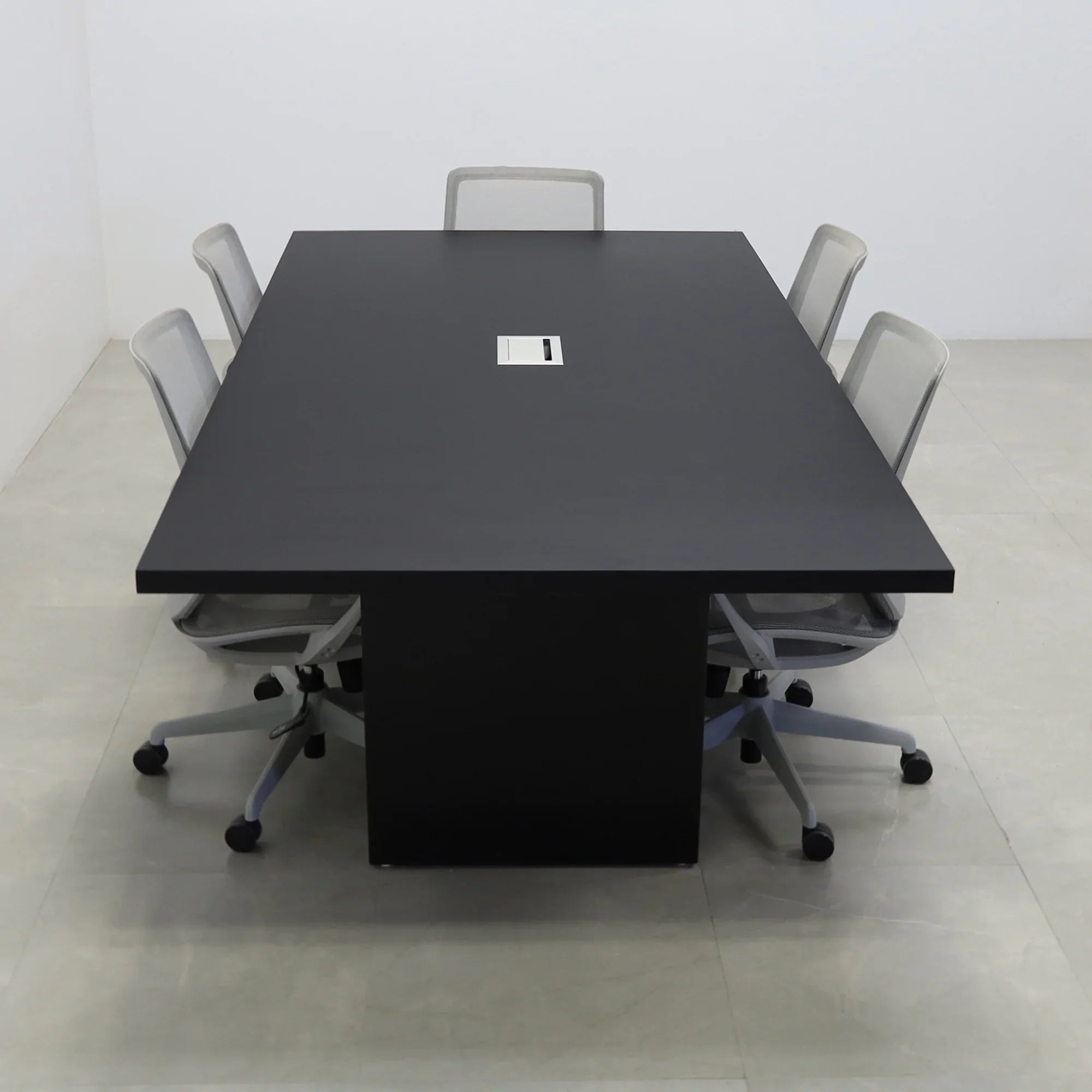 92 inches Newton Rectangular Conference Table in Black Traceless Laminate top and Black Matte Laminate base finish. Ellora power box, and six gray chairs shown here.