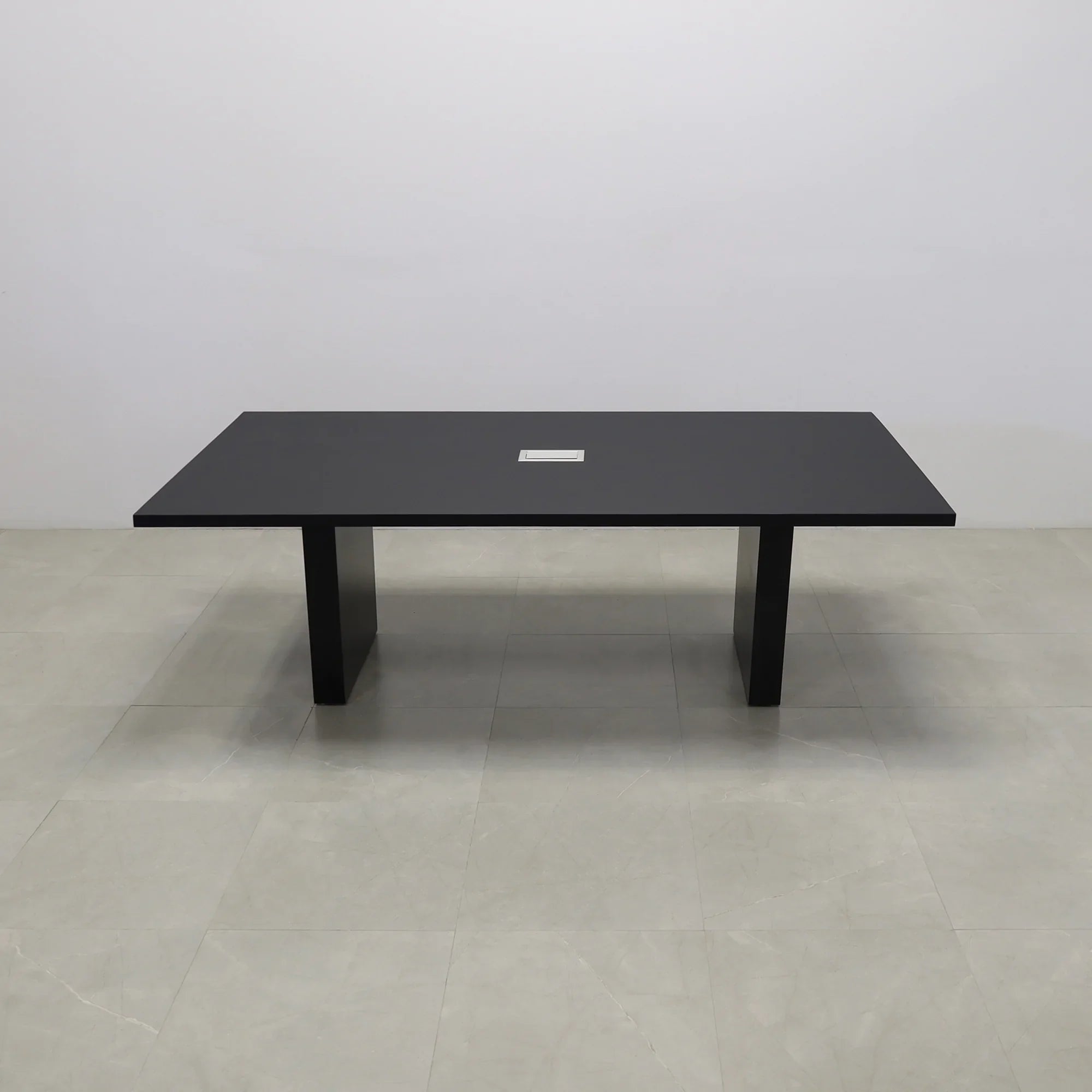 92 inches Newton Rectangular Conference Table in Black Traceless Laminate top and Black Matte Laminate base finish. Ellora power box, and six gray chairs shown here.