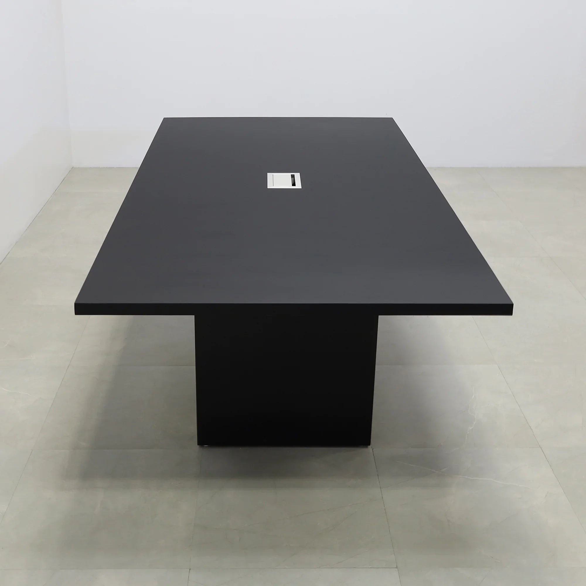 92 inches Newton Rectangular Conference Table in Black Traceless Laminate top and Black Matte Laminate base finish. Ellora power box, and six gray chairs shown here.