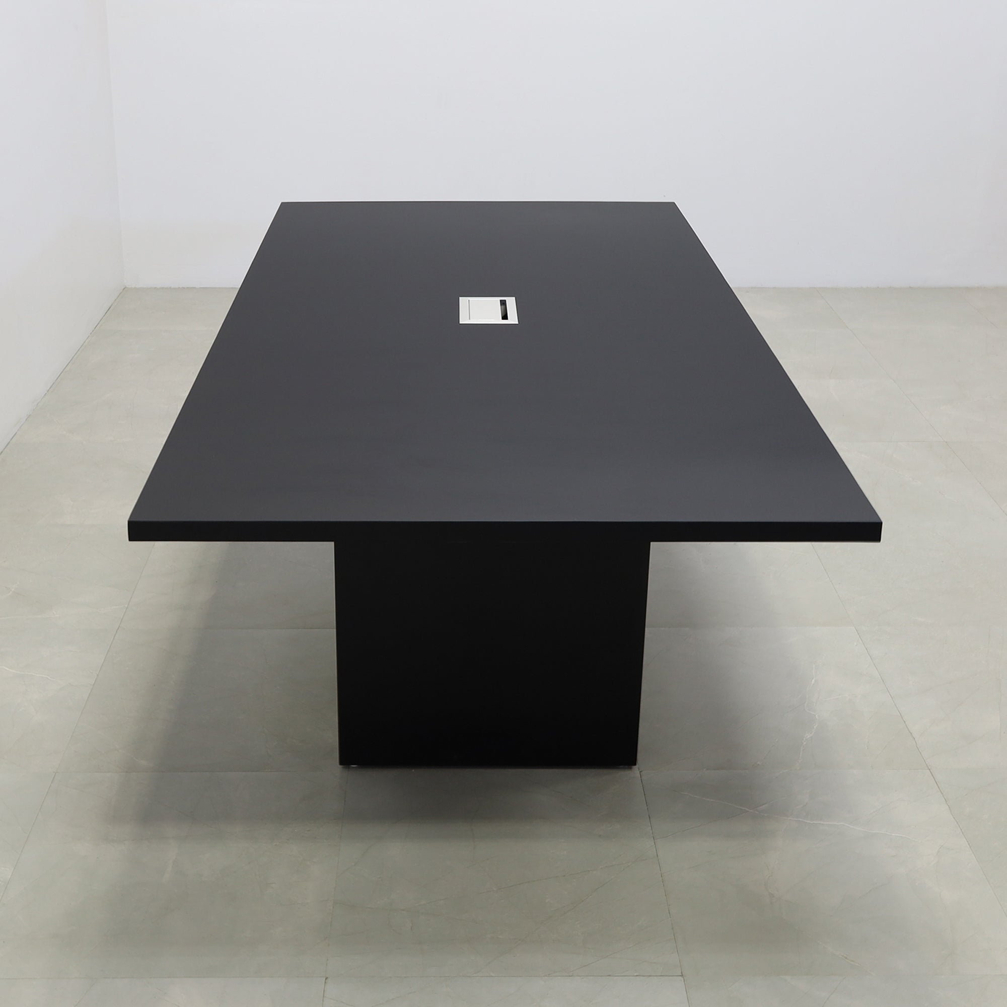 92 inches Newton Rectangular Conference Table in Black Traceless Laminate top and Black Matte Laminate base finish. Ellora power box, and six gray chairs shown here.