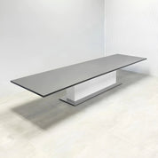 180_Newton Rectangular Conference Table with Laminate Top and X3 Base with storm gray matte laminate top, white matte laminate tambour pedestal, and metal powder coated silver base.