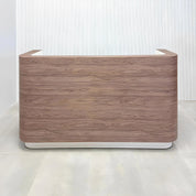 Nola Custom Reception Desk with hazel walnut matte laminate main desk, dover off-white workspace, and dover off-white toe-kick.