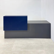 90-inch Los Angeles Custom Reception Desk in navy blue matte laminate counter, storm gray matte laminate desk, and warm white LED.