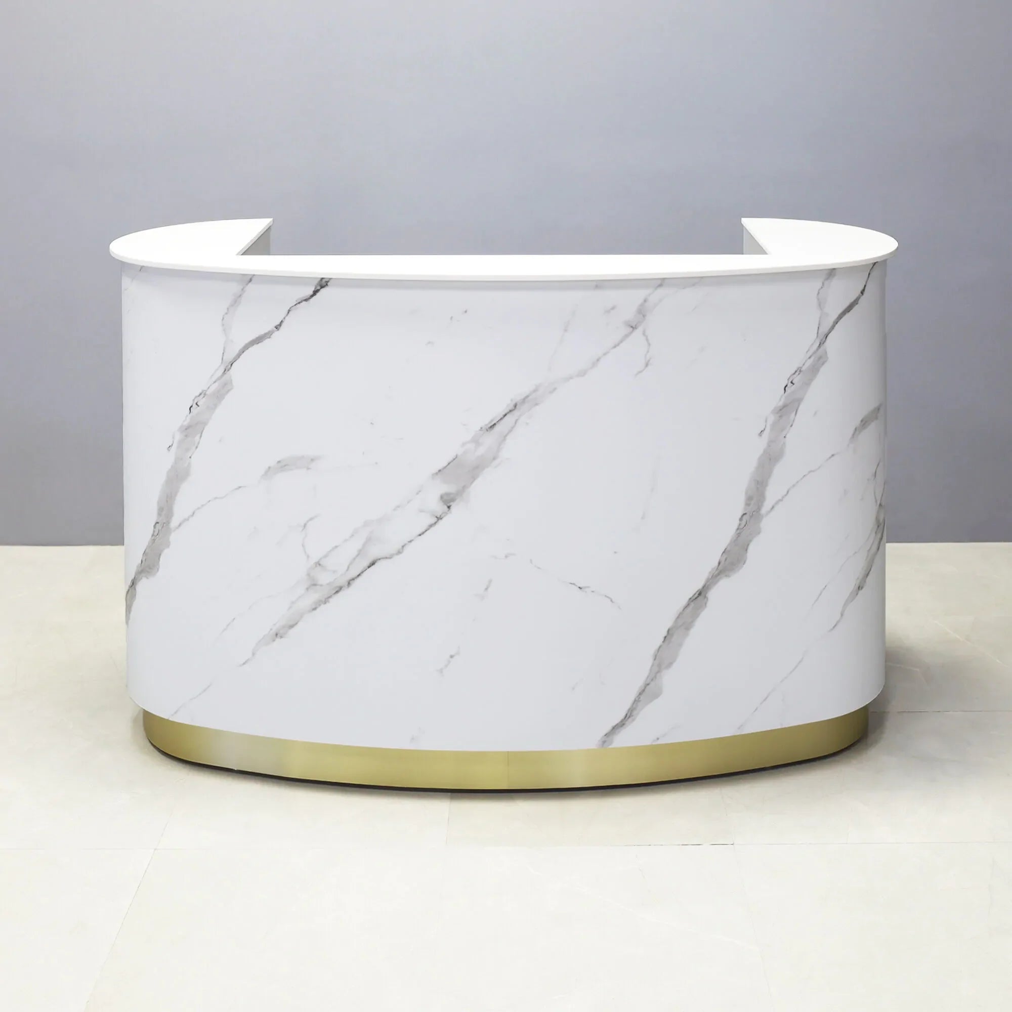 2" white solid engineered surface top, calcutta stone pvc front panel, fog gray laminate workspace and brushed gold toe-kick, with white LED, shown here.