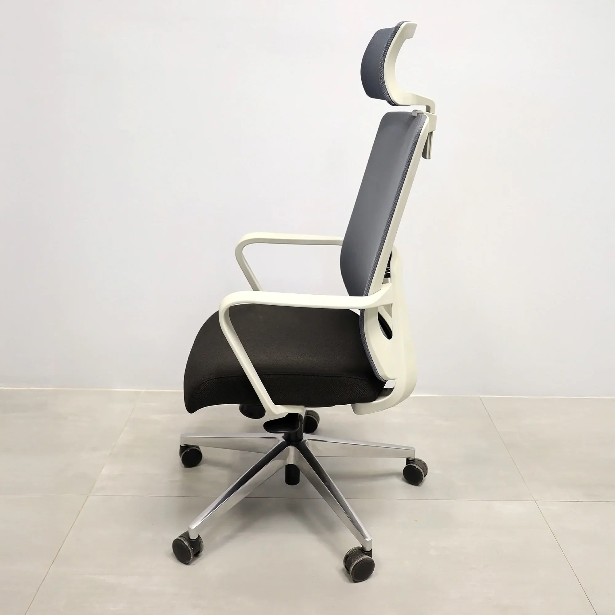 Terra Office Chair with Fixed Arms in light gray mesh back and black fabric seat cushion, shown here.
