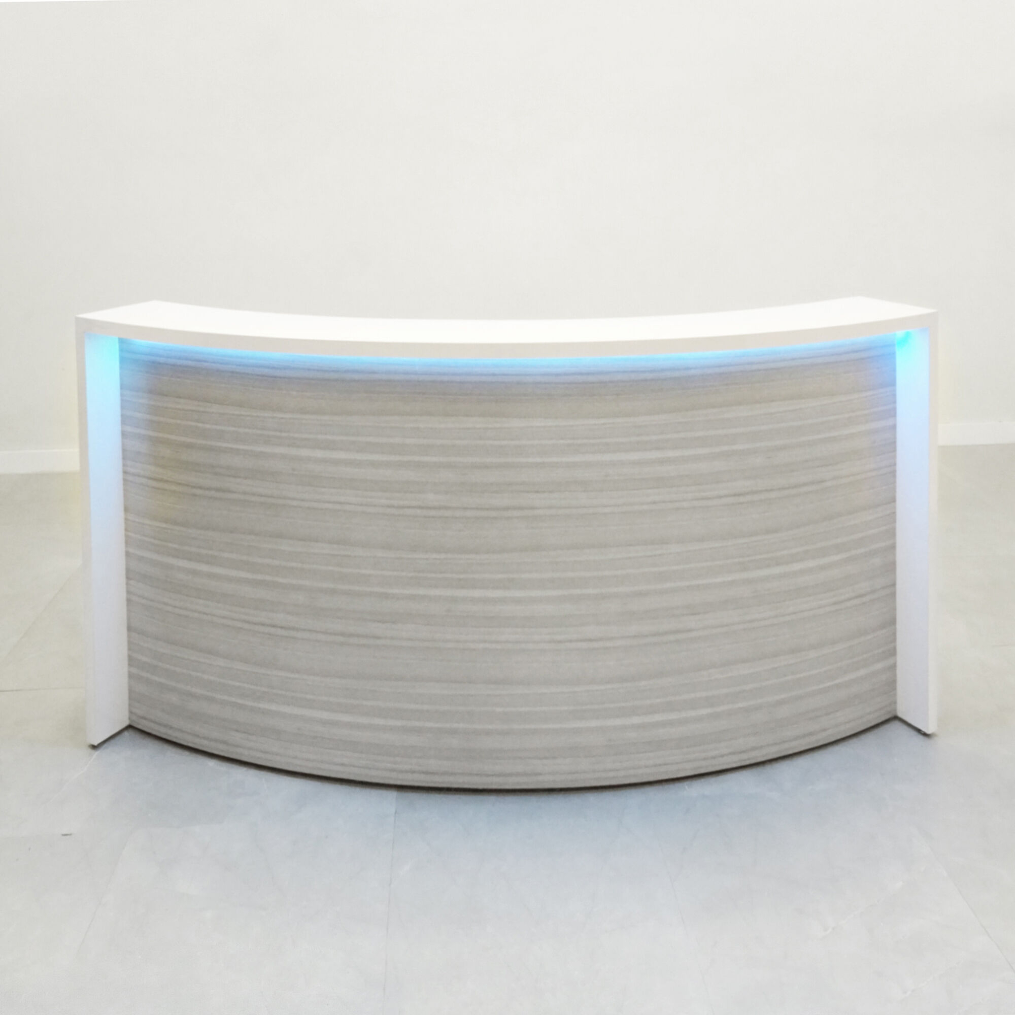 84-inch Seattle X1 Custom Reception Desk in white matte laminate desk, and special laminate curved front panel, with multi-colored LED, shown here.