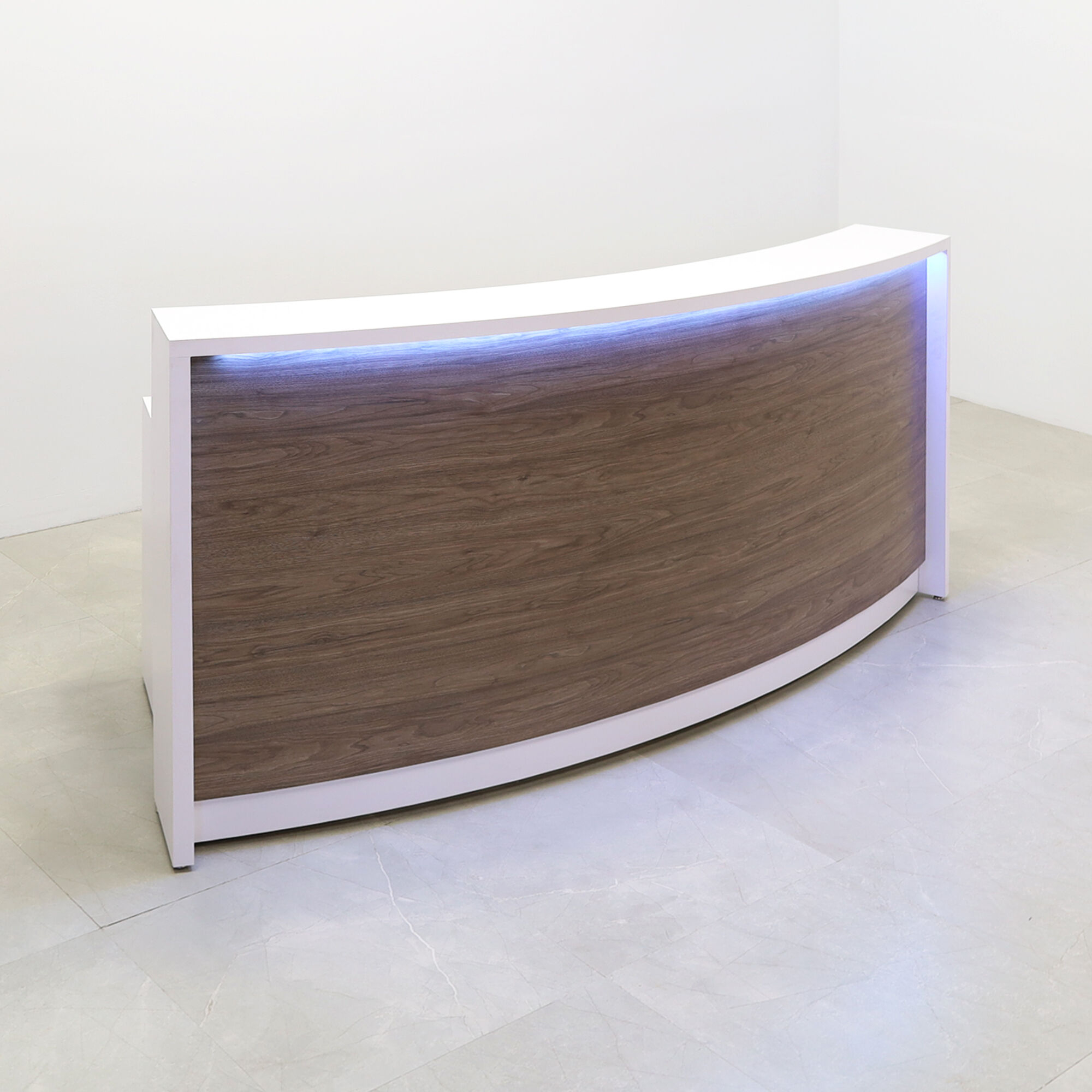 90-inch Seattle X1 Custom Reception Desk in white matte laminate desk, and hazel walnut matte laminate curved front panel, with multi-colored LED, shown here.